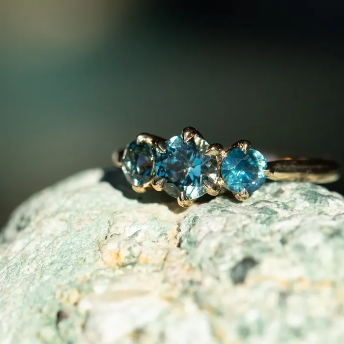 Rings Daniel Stair 082ct Songea and Nigerian Teal Sapphire Three Stone Ring in 14K Yellow Gold